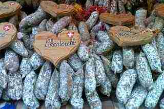 Annecy France Market Day - Stall selling sausages made from ground meat Annecy France Market Day - Stall selling sausages made from ground meat