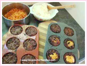 baked ground beef muffins with mashed toppings at the ready