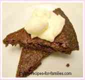Two slices of the best easy brownies served for dessert with cream