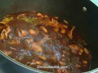 The sauce for the coq au vin thickens on simmering