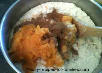 All ingredients for easy pumpkin bread in the mixing bowl 