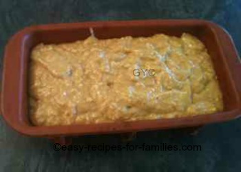 The smooth bread batter poured into the loaf tin