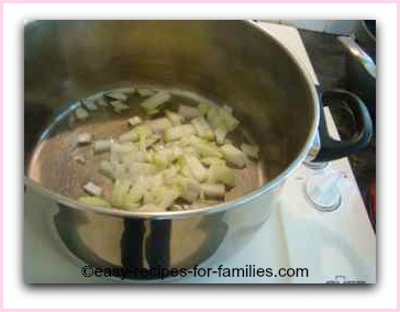 onions frying in a soup pot