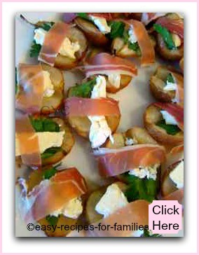 A healthy appetizer of roasted pears wrapped in proscuitto