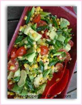 A Healthy recipe Salad of corn kernels, avocado and cherry tomatoes