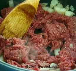 Fry on high heat ground beef and  onions