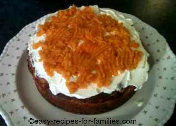 Pumpkin puree on top of layer of whipped cream as topping for a pumpkin cheese cake recipe