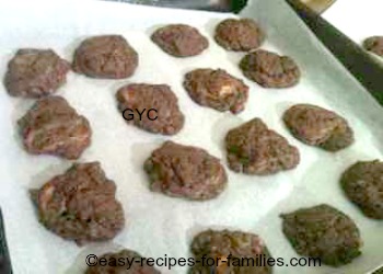 Cookie dough in neat rows on a baking tray