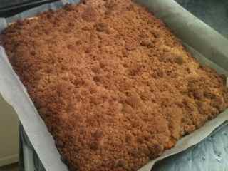 Delicious pumpkin crumble layered with pie crust, pumpkin and crumble