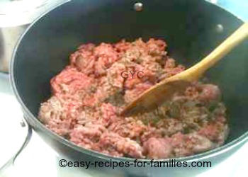 Meat being browned in a non stick pot