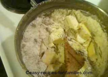 Cut butter into small pieces into the flour