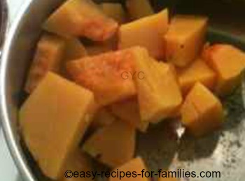 Cooked pumpkin in a saucepan, drained