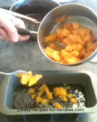 Spoon in cooked pumpkin cubes