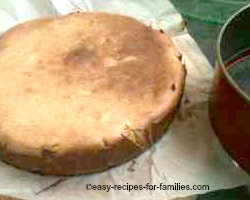 Remove the crustless pumpkin pie by lifting the baking paper