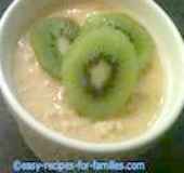 A bowl of creamy rice pudding topped with Kiwi Fruit