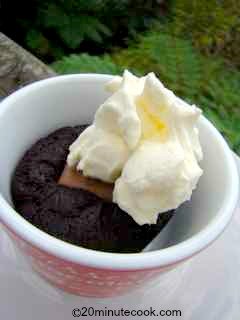 Chocolate Dessert topped with thick whipped cream.