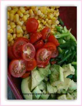 corn salad with cherry tomatoes, avocado and spring onions