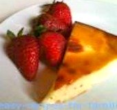 A slice from the honey cake recipe with a serve of strawberries