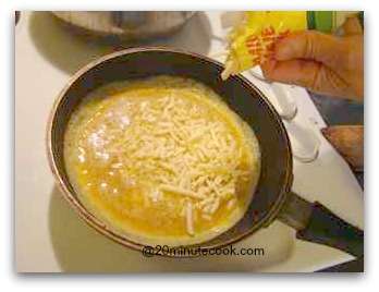 Add Shredded Cheese To The Omelet