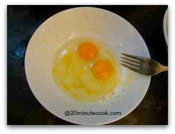 Break Two Eggs In A Bowl and Beat With A Fork