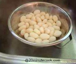 Gnocchi draining in a colander in the sink