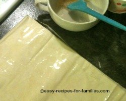 Spray or brush oil onto each side of each sheet of filo pastry