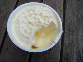 Tub of cream cheese measured into portions