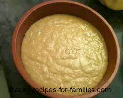 The pumpkin cake batter in a round 9 inch silicone baking tin