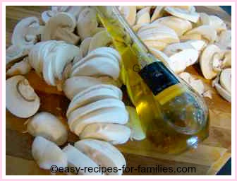 sliced mushrooms and a bottle of garlic olive oil